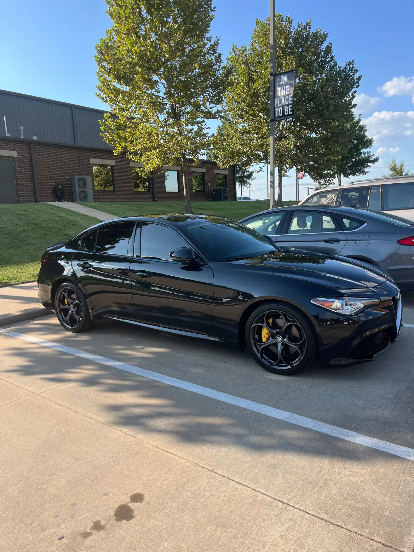 Black 2018 Alfa Romeo sedan photographed in Louisiana